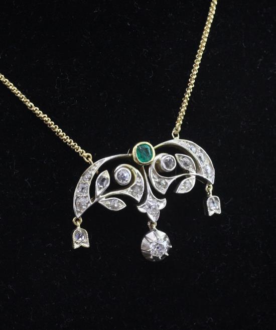 A 15ct gold, emerald and diamond drop pendant on a 9ct gold chain, pendant approx. 1in.